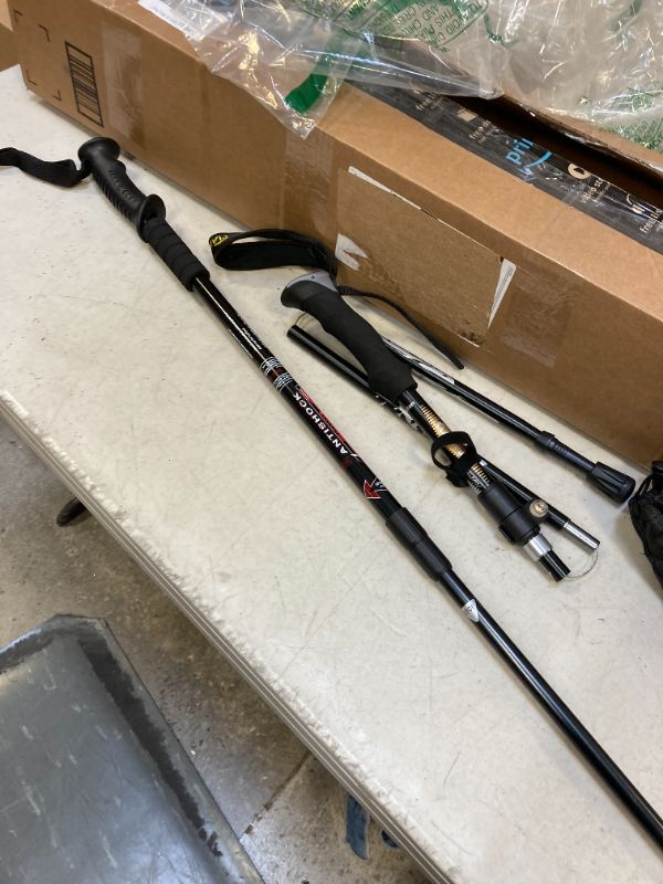 Photo 1 of Aihoye Hiking Trekking Poles, 2 Pack Collapsible,Lightweight, Anti Shock, Hiking or Walking Sticks,Adjustable Hiking Pole for Men and Women black