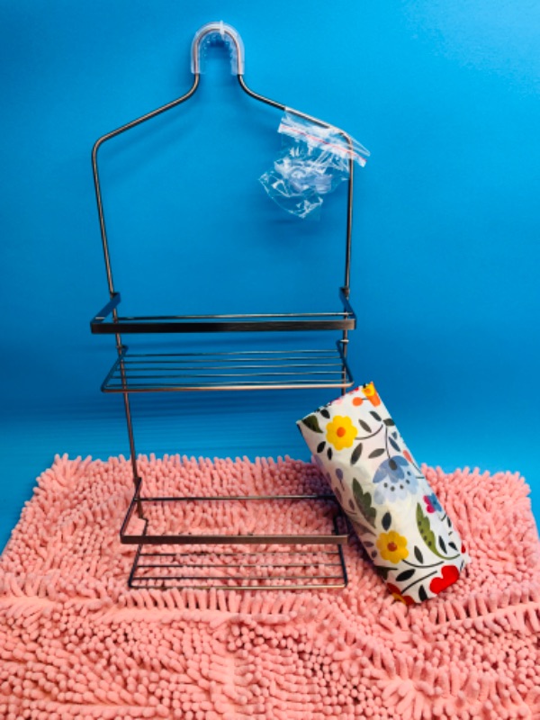 Photo 1 of 636300… bath mat, shower curtain, and shower caddy 