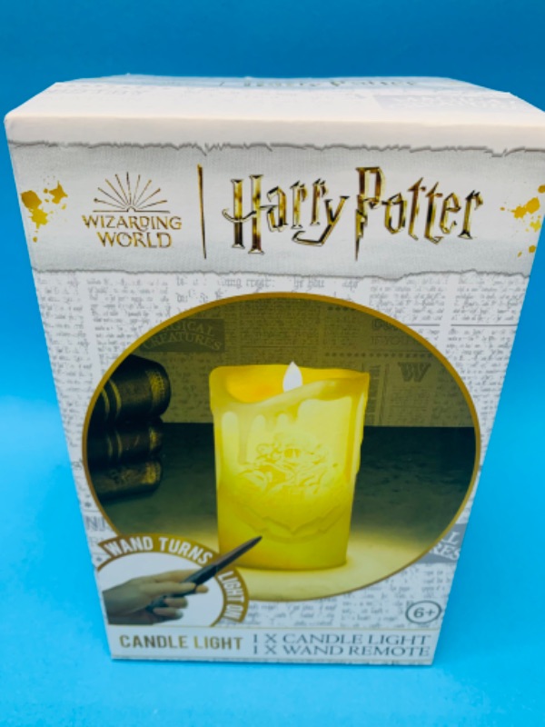 Photo 1 of 636428…Harry Potter candle light-wand turns it  on and off 