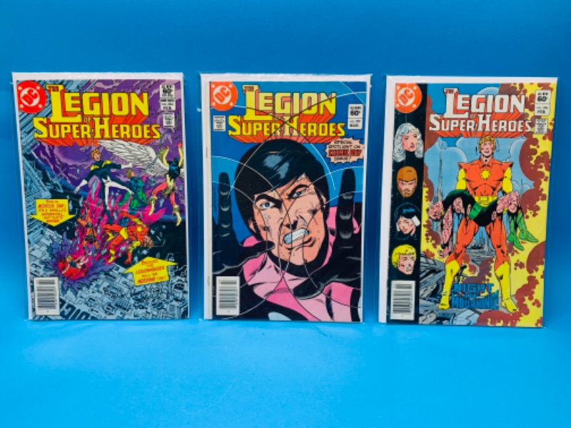 Photo 1 of 637117…3 vintage $.60 legion of super heroes  comics in plastic sleeves - some wear from age