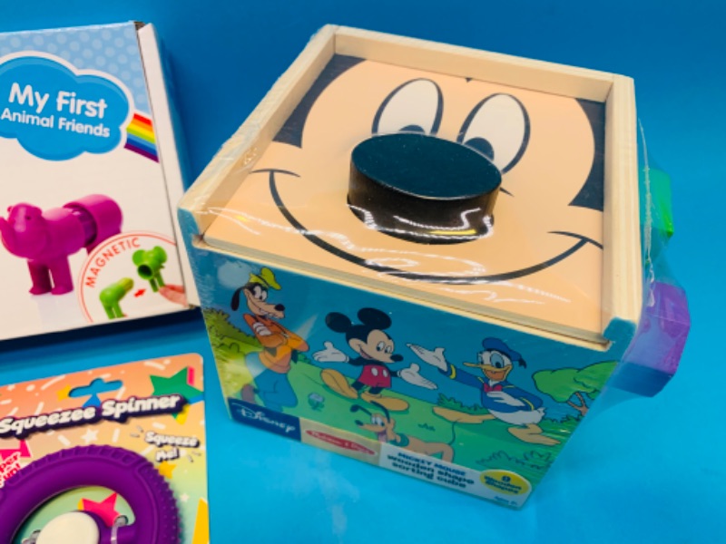 Photo 2 of 637333… Disney wooden shape cube, magnetic animals, and fidget toys
