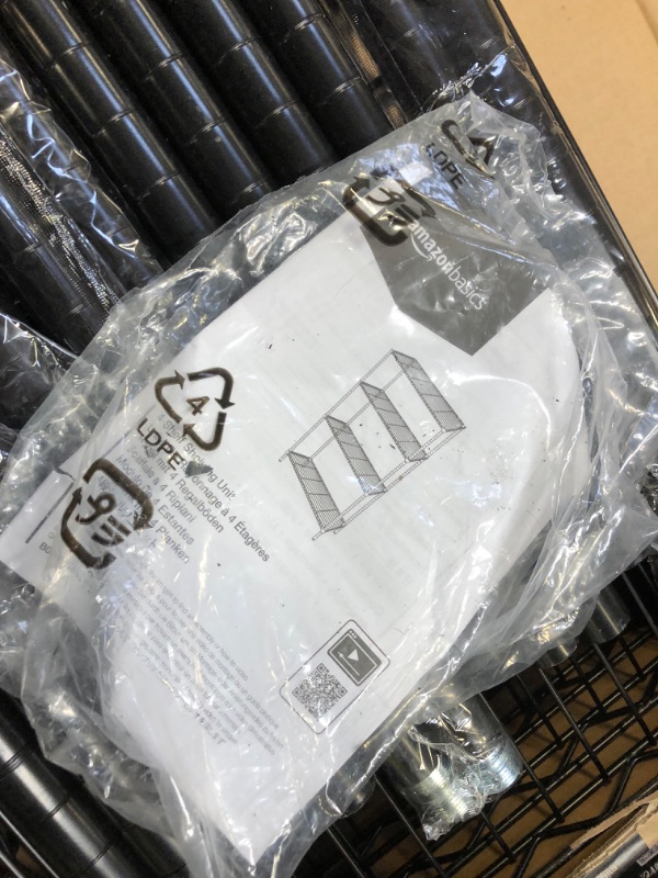 Photo 3 of Amazon Basics 4-Shelf Adjustable, Heavy Duty Storage Shelving Unit (350 lbs loading capacity per shelf), Steel Organizer Wire Rack, Black (36L x 14W x 54H) - LOOSE HARDWARE.
