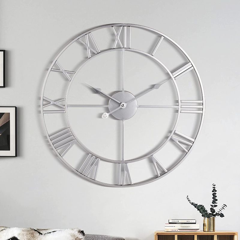 Photo 1 of 1st owned Large Wall Clock, Metal Retro Roman Numeral Clock, Modern Round Wall Clocks Almost Silent , Easy to Read for Living Room/Home/Kitchen/Bedroom/Office/School Decor (Silver, 24 Inch)
