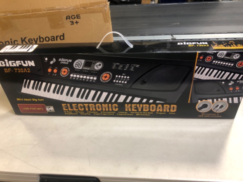Photo 1 of BIGFUN Keyboard Piano for Kids, 61Key Multifunction Electric Piano Keyboard Educational Instrument Toy for 3 4 5 6 7 8 9 10 11 12 Years Old Boys and Girls with Microphone (Black)…---factory sealed