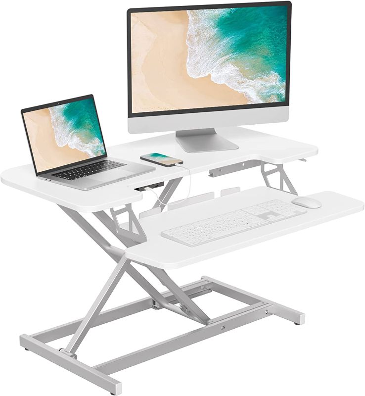 Photo 1 of FEZIBO 32” Height Adjustable Standing Desk Converter with USB Charging Port, Quick Sit to Stand Tabletop Dual Monitor, Stand Up Desk Riser for Home Office, White ( USED ITEM ) 