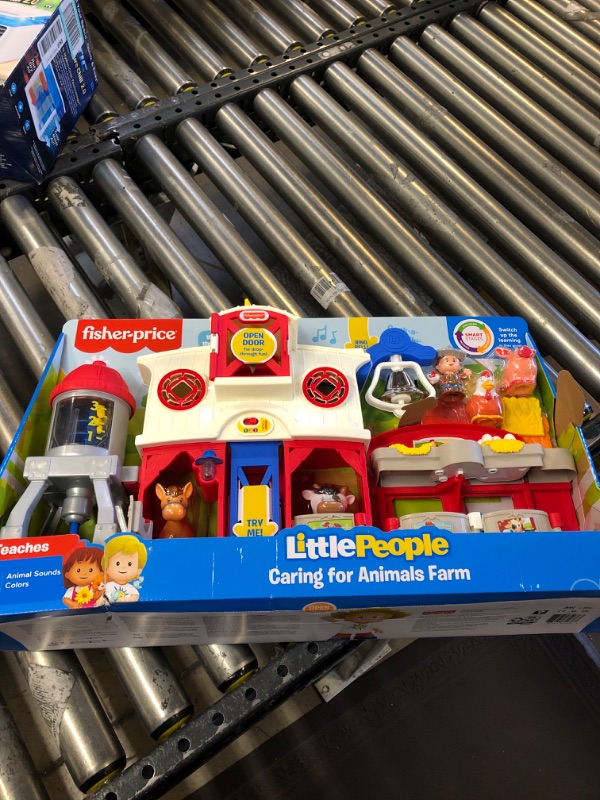 Photo 2 of Fisher-Price Little People Farm Toy, Toddler Playset with Lights Sounds and Smart Stages Learning Content, Caring for Animals Farm? Standard