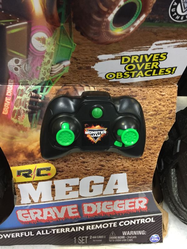 Photo 4 of Monster Jam Official Mega Grave Digger All-Terrain Remote Control Monster Truck with Lights 1: 6 Scale Kids Toys for Boys (BACK TIRE IS BROKEN)
