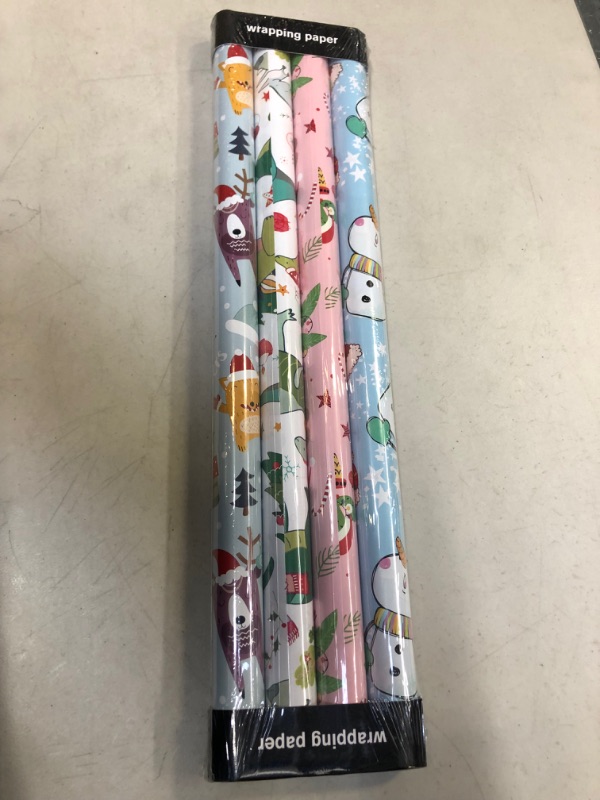 Photo 2 of AUCLAY Christmas Wrapping Paper Rolls for Kids Holiday Gift Wrap - Cute Styles Included Dinosaur, Snowman, Santa Animals, Alpaca and Sloth - Pack of 4, 23.6 Inch X 8 Feet per Roll
