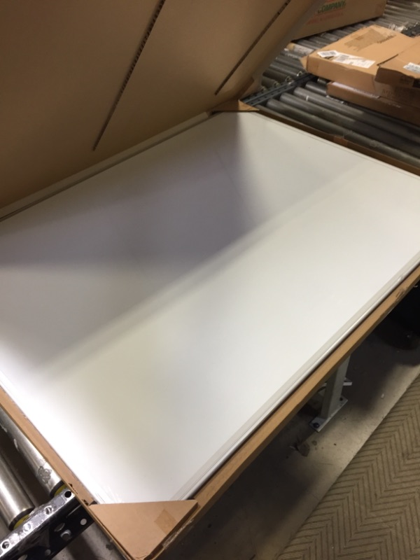 Photo 3 of Amazon Basics Magnetic Dry Erase White Board, 35 x 47-Inch Whiteboard - Silver Aluminum Frame 35" x 47" Magnetic, Aluminum Frame -- MINOR DENT ON FRAME