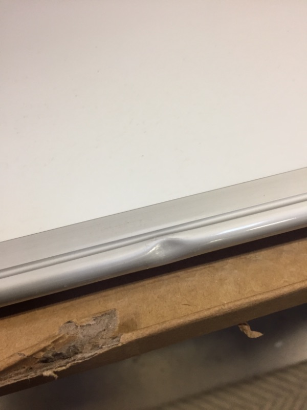 Photo 4 of Amazon Basics Magnetic Dry Erase White Board, 35 x 47-Inch Whiteboard - Silver Aluminum Frame 35" x 47" Magnetic, Aluminum Frame -- MINOR DENT ON FRAME