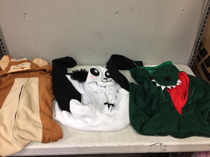 Photo 1 of BAG LOT OF RANDOM SWEATERS AND ONE ONESIE --MIXED SIZES AND STYLES--MIGHT BE STAINED OR DIRTY---