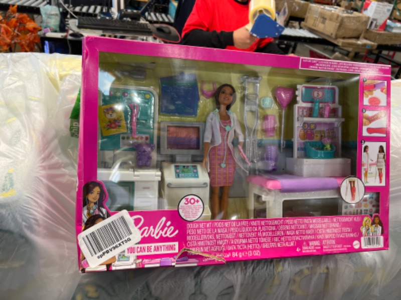 Photo 2 of Barbie Fast Cast Clinic Playset, Brunette Doctor Doll (12-in), 30+ Play Pieces, 4 Play Areas, Cast & Bandage Making, Medical & X-ray Stations, Exam Table, Gift Shop & More, Great Toy Gift