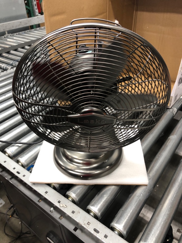 Photo 2 of Lasko 12" Classic Metal Table Fan - 12" Diameter - 3 Speed - Quiet, Carrying Handle, Oscillating - 17.3" Height x 13.3" Width - Metal