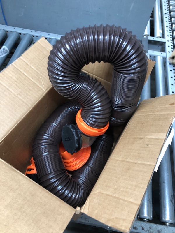 Photo 1 of Camco RhinoFLEX RV Sewer Hose Kit with Swivel Transparent Elbow and 4-in-1 Dump Station Fitting, Brown, 15 Feet (39770) 15ft Sewer Hose Kit Frustration-Free Packaging