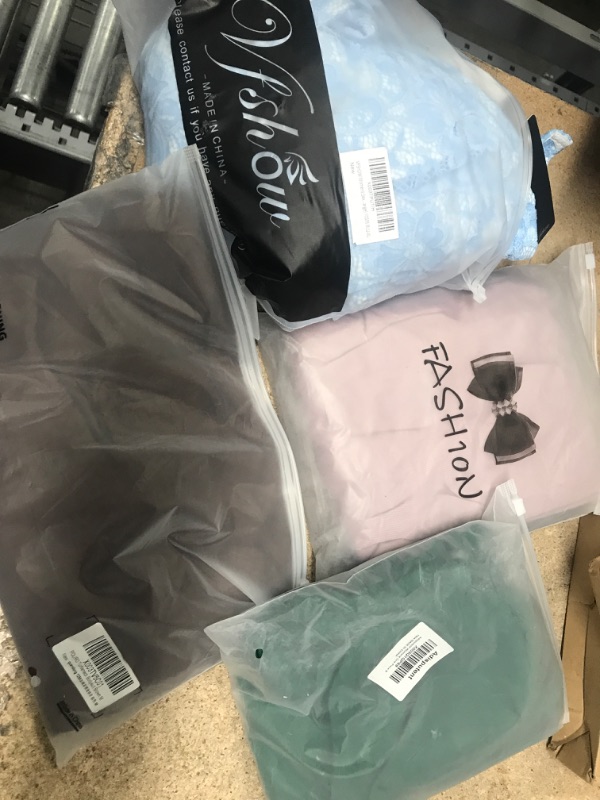 Photo 1 of 4 Piece Assorted Clothing Bundle