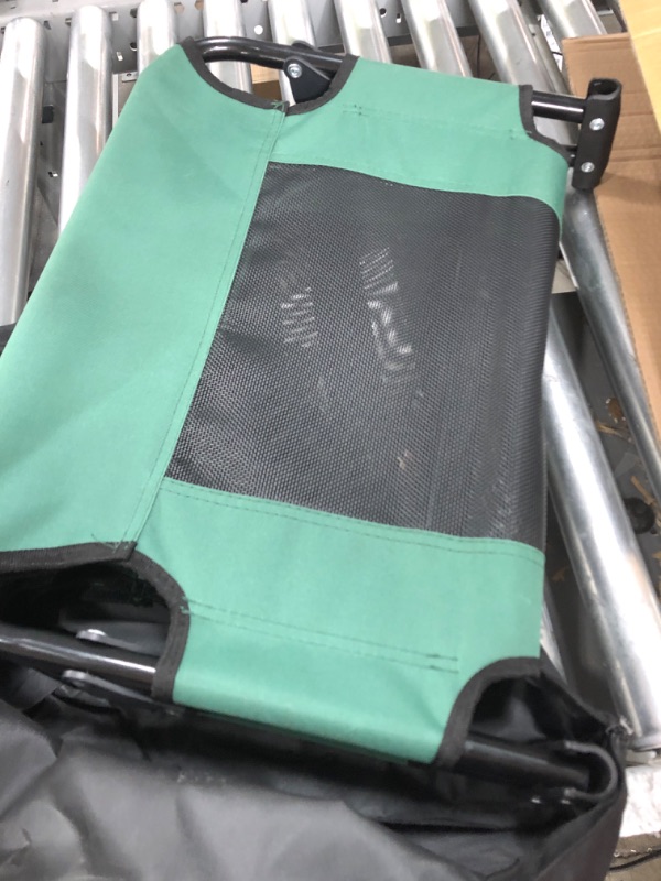Photo 1 of Outrav Elevated Dog Cot with Steel Frame - Foldable Raised Play and Rest Bed for Dogs and Cats - Heavy Duty Strong Material - Pet Cot with Bonus Storage Bag (Small 30” x 20” x 7”, Green) Small 30” x 20” x 7” Green