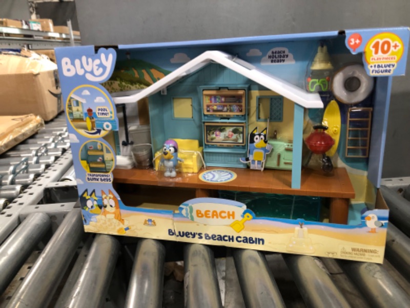 Photo 2 of BLUEY Beach Cabin Playset, with Exclusive Figure with Goggles. Includes 10 Play Pieces and Sticker Sheet