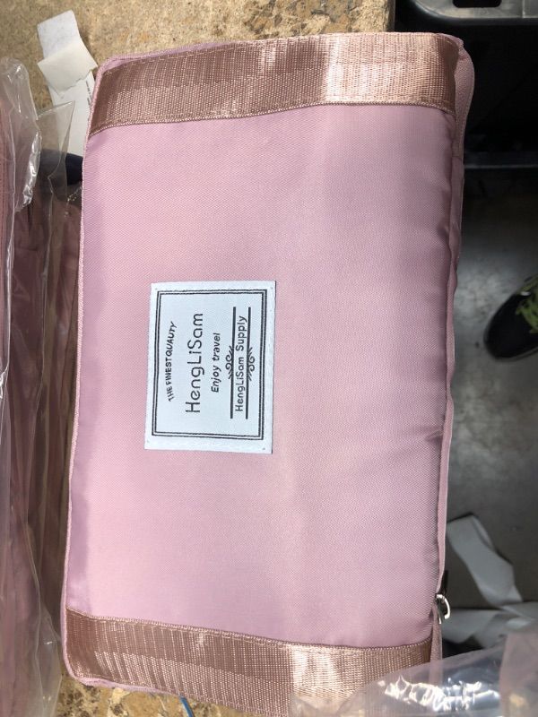 Photo 1 of Folding Travel Bag, Large Capacity Waterproof Expandable Travel Duffel Tote Bag, Carry on Luggage Sport Duffle Weekender Overnight for Women and Girls (Pink)