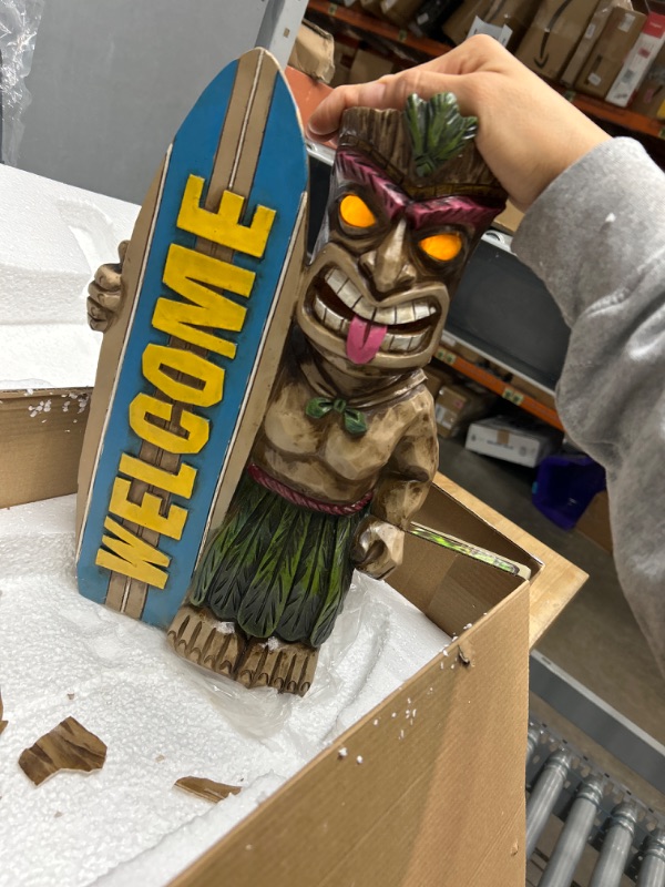 Photo 2 of **broken in back but lights up**
VP Home Welcome Tiki Statue with Surfboard - Solar Powered 14" Tall Tiki Stand with Automatic Switch On Flickering Eyes LED Light - for Outdoor Decoration - Perfect for Beach Resort, Halloween Decor
