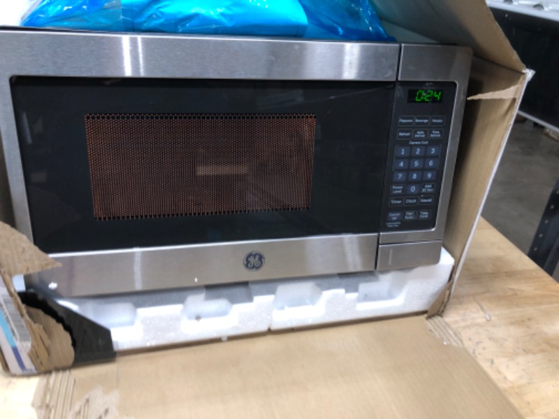 Photo 3 of **POWERS ON**
GE Countertop Microwave Oven | 0.7 Cubic Feet Capacity, 700 Watts | Kitchen Essentials for the Countertop or Dorm Room | Stainless Steel