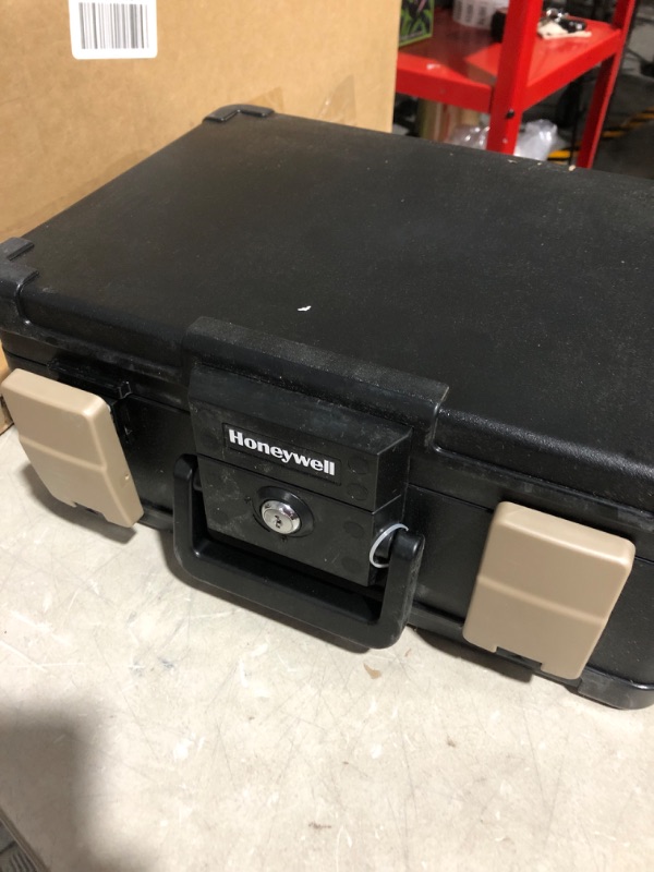 Photo 3 of * used item * see all images * 
Honeywell 0.24 cu. ft. Molded Fire Resistant and Waterproof Portable Chest with Carry Handle