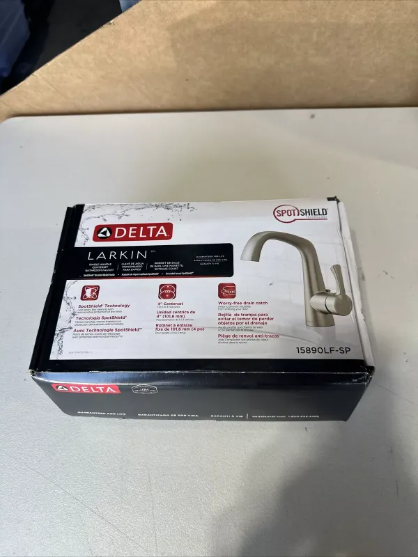 Photo 1 of Upgrade your bathroom with this Delta Larkin Single Handle Bathroom Faucet. With a sleek brushed nickel finish and a spout height of 5-3/16, this faucet is perfect for any home bathroom. The faucet is made of durable brass material and comes with a 10-yea