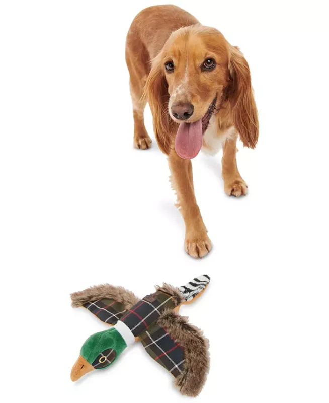 Photo 1 of Barbour Plaid Logo Pheasant Squeaker Stuffed Dog Toy. Made in Germany. Your pup will be eager to bird-dog this one! This soft Barbour features a fetch-ready shape and a fun squeaker inside. Approx. dimensions: 36 cm x 31 cm x 6 cm. Squeaker inside. Shell: