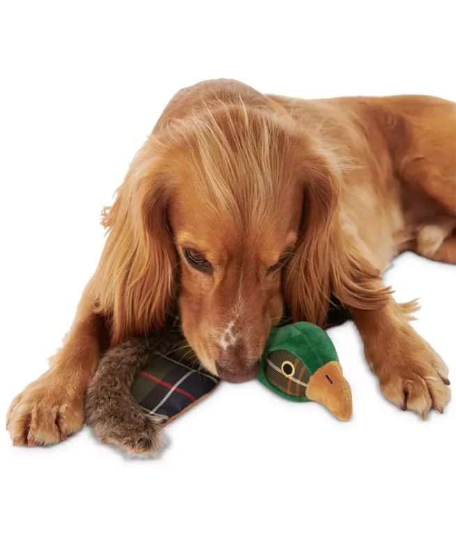 Photo 2 of Barbour Plaid Logo Pheasant Squeaker Stuffed Dog Toy. Made in Germany. Your pup will be eager to bird-dog this one! This soft Barbour features a fetch-ready shape and a fun squeaker inside. Approx. dimensions: 36 cm x 31 cm x 6 cm. Squeaker inside. Shell: