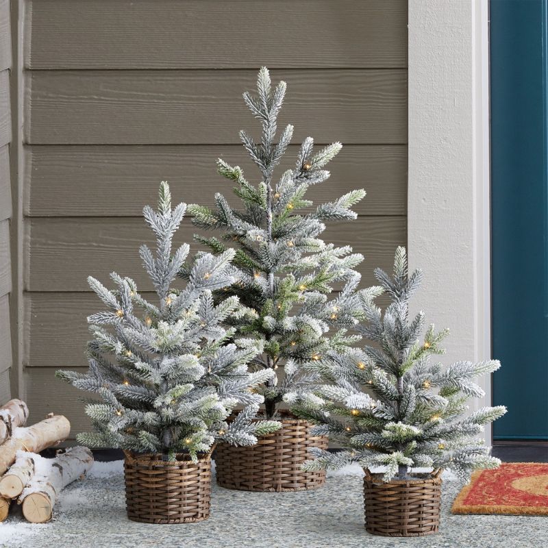 Photo 1 of Set of 3 pieces Flocked Trees With LED Lights/  Light up your home this holiday season with this 3 piece flocked tree set in beautiful woven vinyl baskets. Suitable for indoor or outdoor use, this set is illuminated with twinkling LED lights for a festive