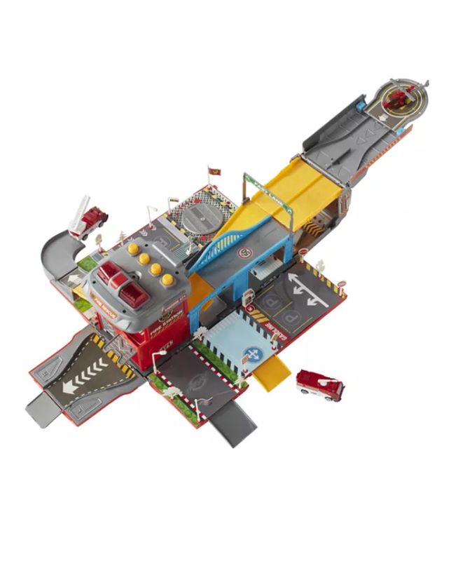 Photo 1 of FAST LANE Fire City Play Set, Product dimension - 7.5" L x 33.9" W x 15.6" H. Set includes - 1 fold out fire truck, 3 vehicles (2 cars and 1 helicopter) and road sign accessories. Ages 3 to 8 years. Requires 2 AA batteries (not included). Fold out fire tr