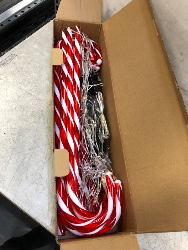 Photo 2 of 28” Candy Cane Lights Outdoor Pathway, 42 Feet in Total Length with 12 Pack Candy Cane Pathway Lights with Shiny Star for Outside Christmas Decorations, 10 LED Lights in Each Light Up Candy Canes
