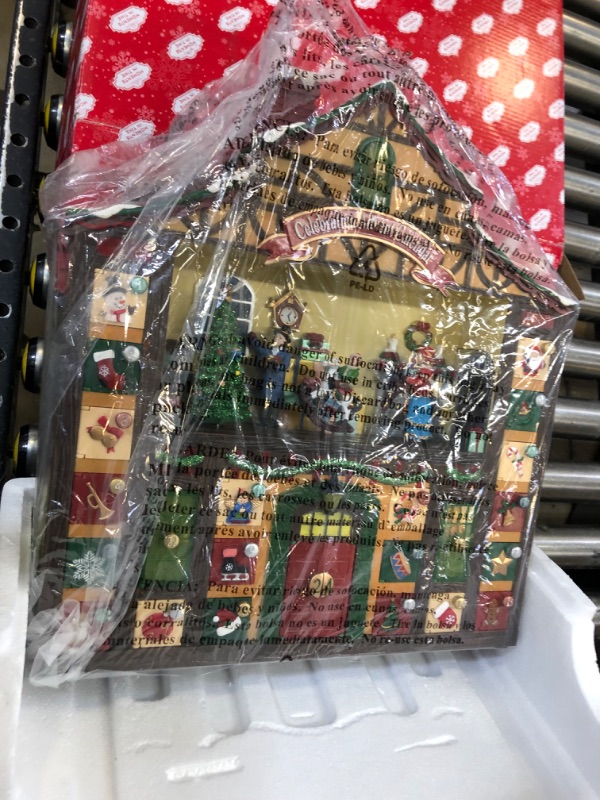 Photo 1 of Christmas Decor Animated Advent Calendar House, Christmas Tabletop Decor with LED Lights and Christmas Music - Power Adapter (included) (16.2"H x 15.4"W x 3.7"D) BO, 3 AA batteries not included.