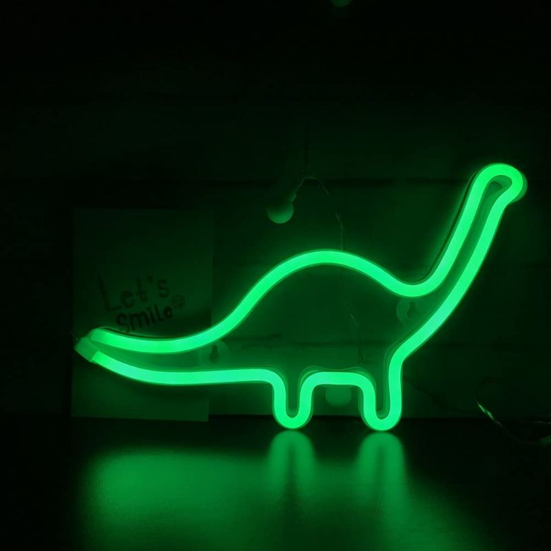 Photo 1 of QiaoFei Cute Dinosaur Night Light for Kids Gift's LED Dinosaur Neon Signs Dino Lamp for Wall Decor Bedroom Decorations Home Party Holiday Decor Battery or USB Operated Table Night Light Signs