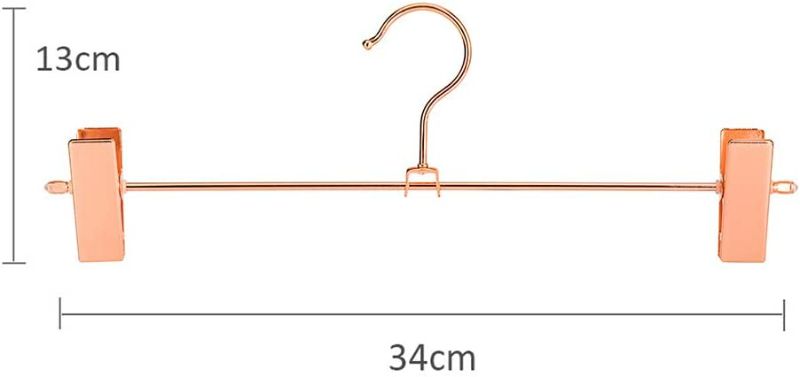 Photo 2 of Jetdio Metal Heavy Duty Pants Skirt Slack Hangers,Trousers Hangers with Two Adjustable Non Slip Clips Hanger Rack Swivel Hook, 12 Pack, Copper Gold
