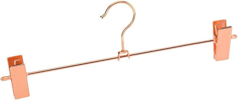 Photo 3 of Jetdio Metal Heavy Duty Pants Skirt Slack Hangers,Trousers Hangers with Two Adjustable Non Slip Clips Hanger Rack Swivel Hook, 12 Pack, Copper Gold
