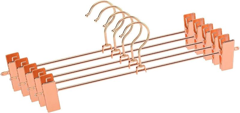 Photo 1 of Jetdio Metal Heavy Duty Pants Skirt Slack Hangers,Trousers Hangers with Two Adjustable Non Slip Clips Hanger Rack Swivel Hook, 12 Pack, Copper Gold
