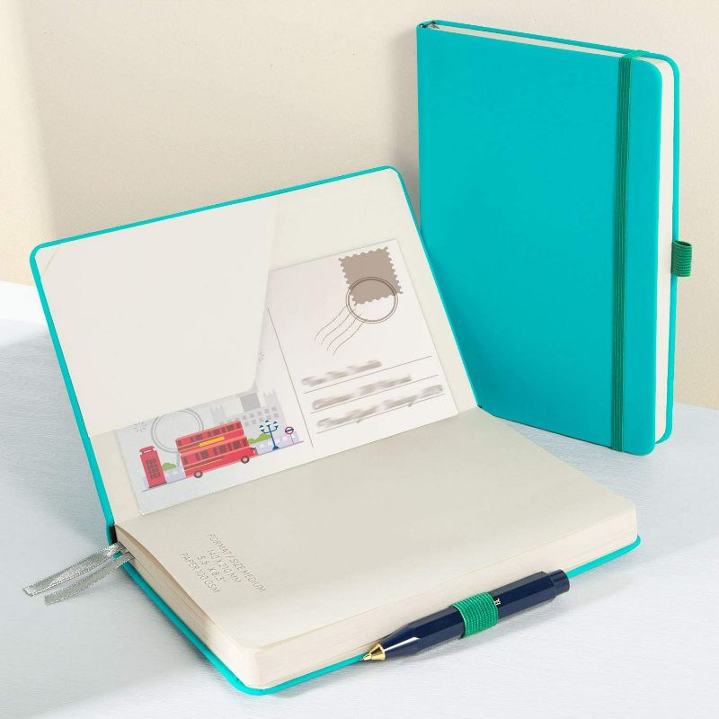 Photo 4 of daolen Dotted Classic Notebook Journal [A5][ Leather Hardcover ][ 160 Numbered Pages ][ 100 gsm ] Premium Thick Paper with Inner Pocket 5.5"x 8.15" - Turquoise
