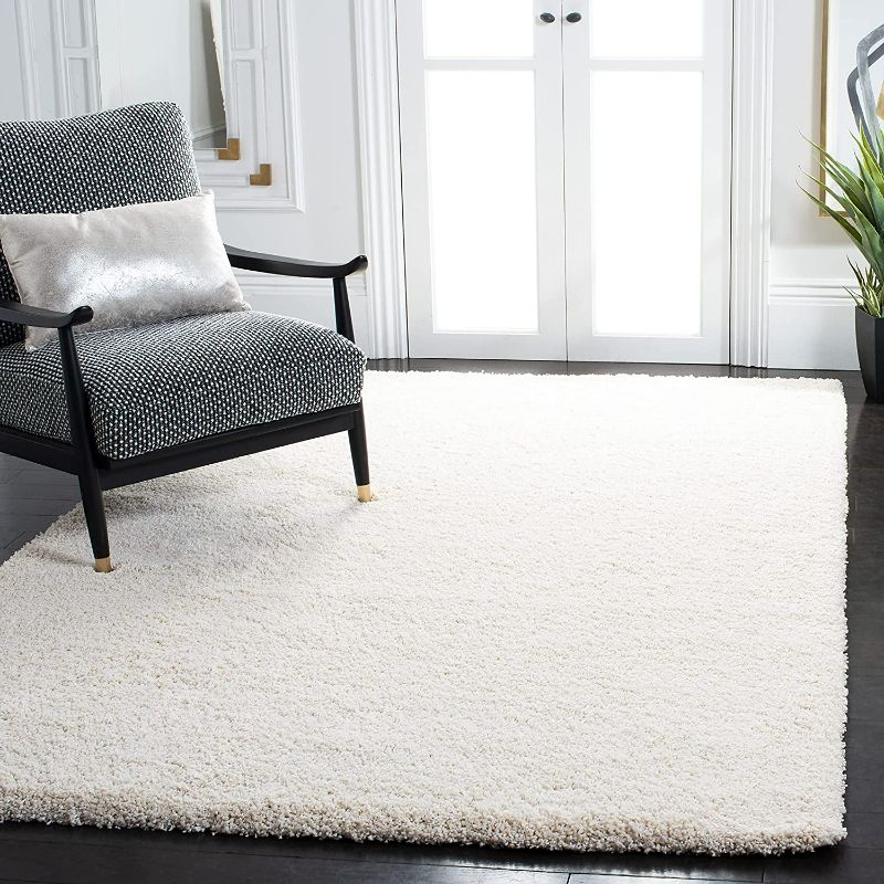 Photo 1 of SAFAVIEH Milan Shag Collection 4' x 6' Ivory SG180 Solid Non-Shedding Living Room Bedroom Dining Room Entryway Plush 2-inch Thick Area Rug
