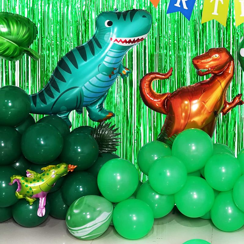 Photo 3 of Dinosaur Birthday Party Decorations Jurassic Park Themed Dino Birthday Party Supplies Include Dinosaurs Balloons Backdrop Birthday Banner Paper Fan Curtains Perfect for Boys and Girls Birthday Party
