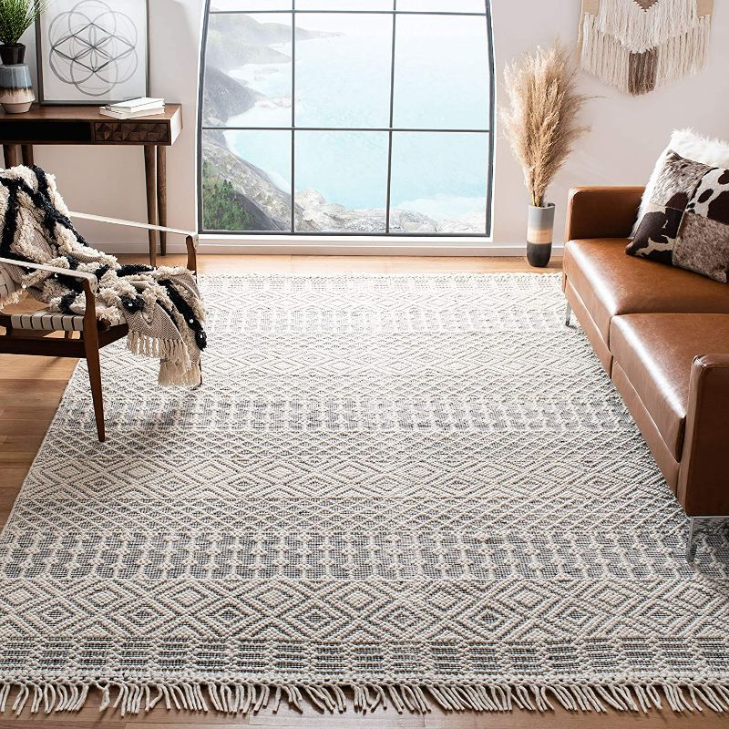 Photo 1 of SAFAVIEH Natura Collection 6' x 9' Ivory / Black NAT852Z Handmade Moroccan Boho Fringe Wool Area Rug
