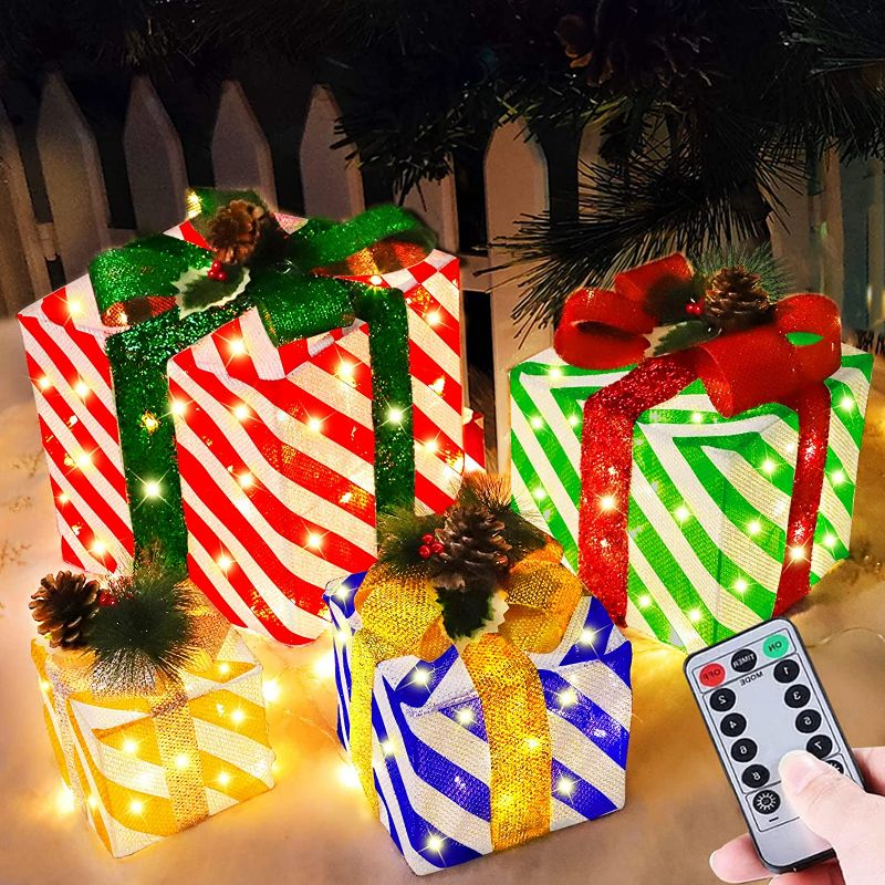 Photo 1 of [ Super Large 12"-10"-8"-7" ] 4 Pack Lighted Gift Boxes Christmas Decorations 70 LED 8 Modes Timer Remote Control Battery Operated Light up Stripe Present Box Christmas Indoor Outdoor Decor Home Yard SEE PHOTO SIZE AND DESIGN VARIED
