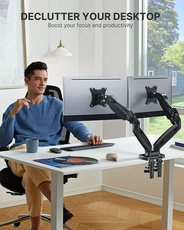 Photo 1 of HUANUO Dual Monitor Stand, Adjustable Spring Monitor Desk Mount for Dual Monitor Mount Holds Max 11.9lbs, Computer Monitor Arms with Wide Range of Motion for Home Office NEW