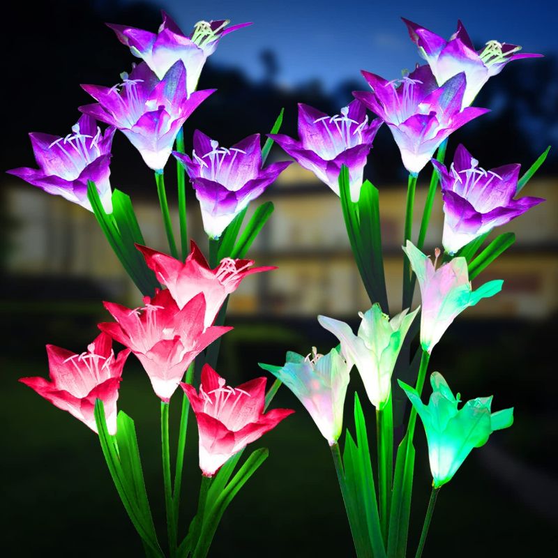 Photo 1 of KOOPER Outdoor Solar Lights, 4 Pack Solar Garden Lights with Bigger Lily Flowers, Waterproof 7 Color Changing Outdoor Lights - Bigger Solar Panel for Garden Patio Yard Pathway Decoration  NEW