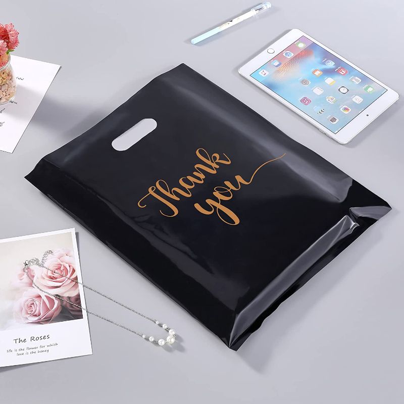 Photo 2 of 
MUKOSEL 100Pcs Thank You Merchandise Bags, Extra Thick 2.36Mil 12x15In Retail Shopping Bags for Goodie bags, Party, Stores, Boutique, Clothes, Business Gift, Reusable Plastic Bags with Handle (Blacke)
