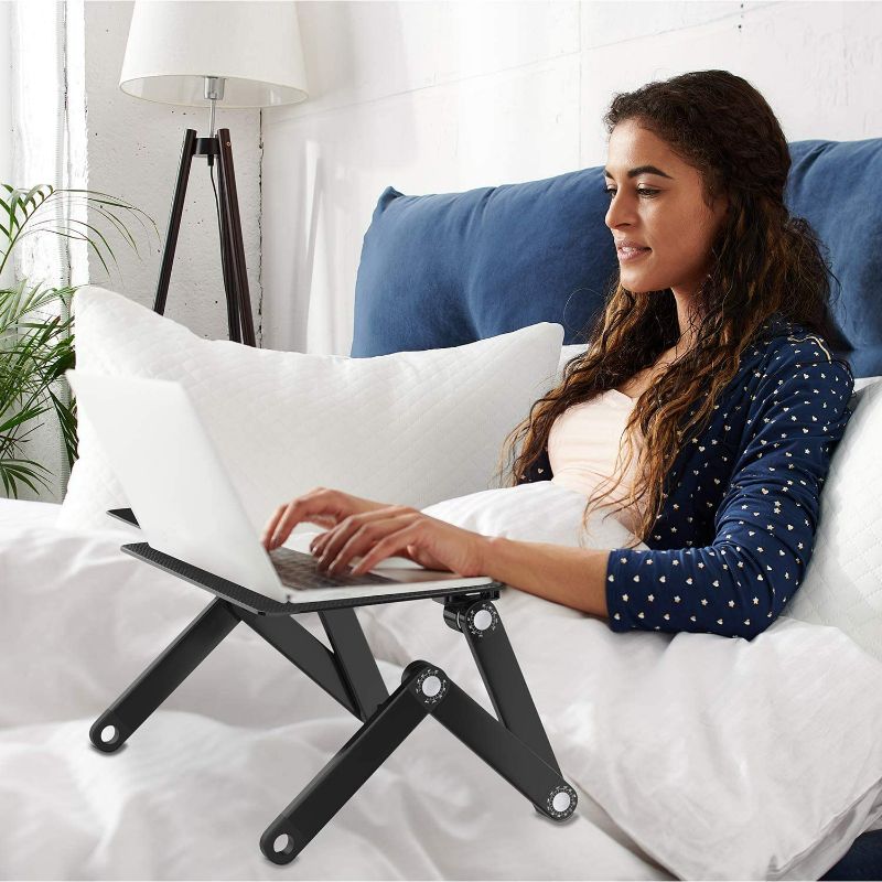 Photo 2 of HUANUO Adjustable Laptop Stand, Portable Laptop Table Stand with 2 CPU Cooling Fans, Ergonomic Lap Desk TV Bed Tray Standing Desk black