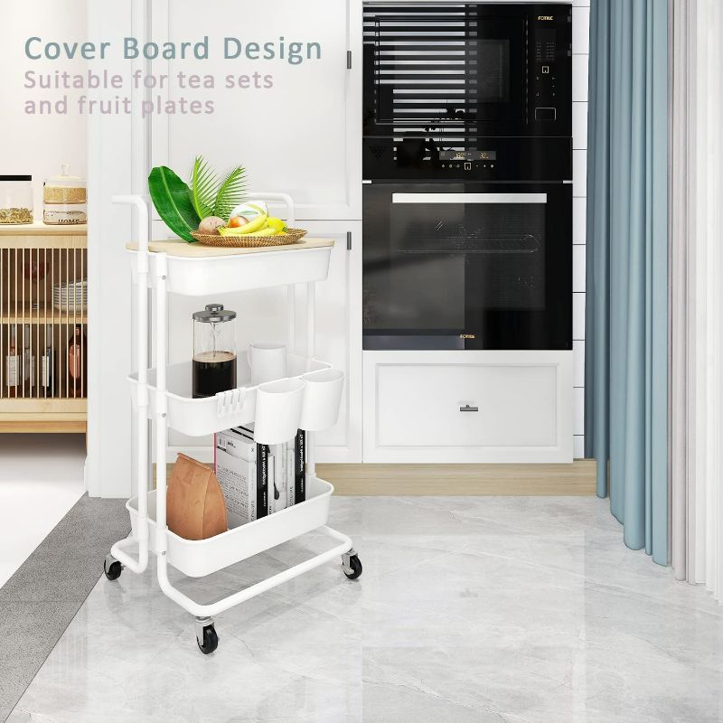 Photo 3 of DTK 3 Tier Utility Rolling Cart with Cover Board, Rolling Storage Cart with Handle and Locking Wheels Kitchen Cart with 2 Small Baskets and 4 Hooks for Bathroom Office Balcony Living Room(White)