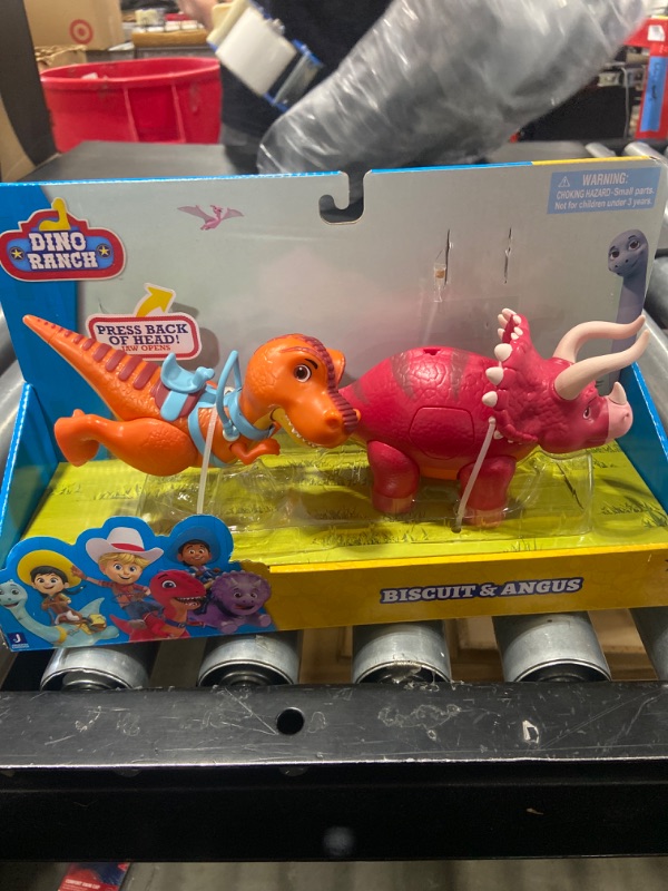 Photo 2 of Dino Ranch Deluxe Dino 2-Pack - Features Biscuit, a 5-Inch Toy T-Rex, and Angus, a 4-Inch Toy Triceratops - Toys for Kids Featuring Your Favorite Pre-Westoric Ranchers
