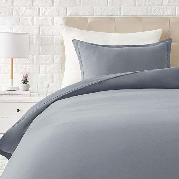 Photo 1 of Amazon basics light-weight microfiber comforter with matching pillow sham in light gray. Size is Twin-Twin XL