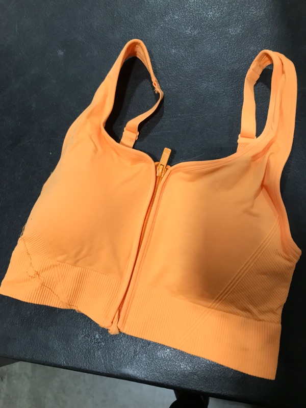 Photo 1 of All in motion front zipper sport bra 
Size Xs
Color Ornage