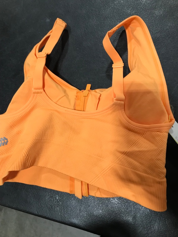 Photo 1 of All in motion front zipper sport bra 
Size Xs
Color Ornage